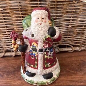 Vintage Santa Luminary with several holes for effect. By Michael Sparks design